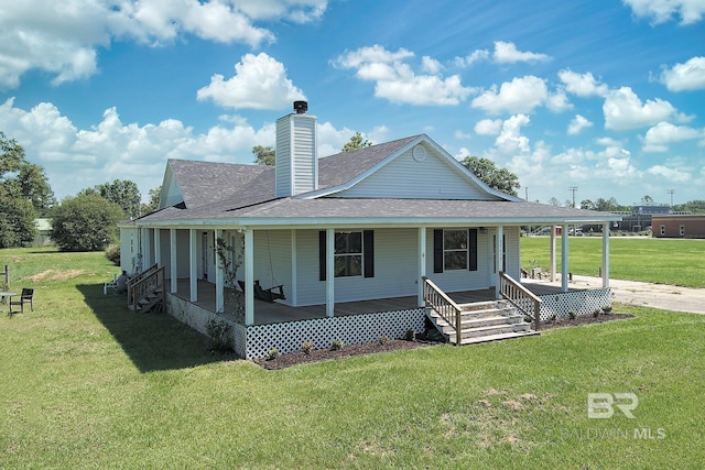 24675 Ulrich Ln, Elberta, AL 36530 - view of front of home featuring a porch, roof with shingles, a front lawn, and a chimney