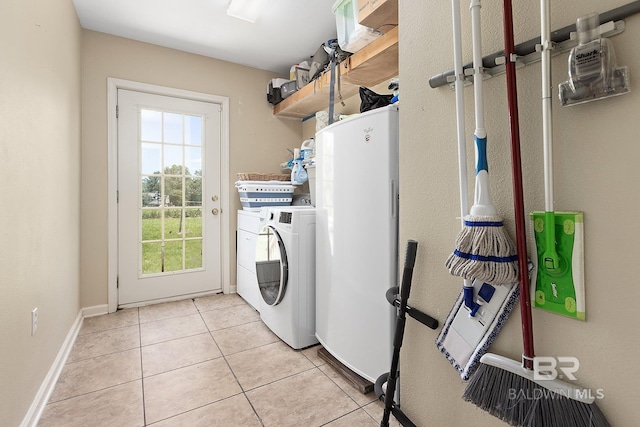 24675 Ulrich Ln, Elberta, AL 36530 - laundry room with independent washer and dryer and light tile patterned floors