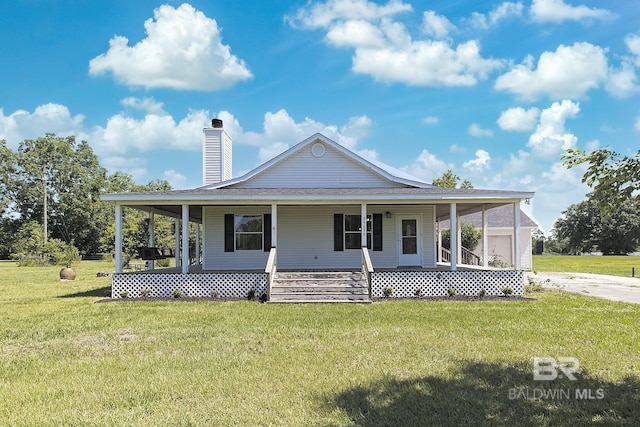 24675 Ulrich Ln, Elberta, AL 36530 - farmhouse-style home with a porch, a front yard, a chimney, and roof with shingles