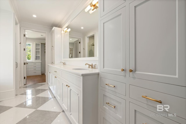 full bath with double vanity, ornamental molding, and tile patterned floors