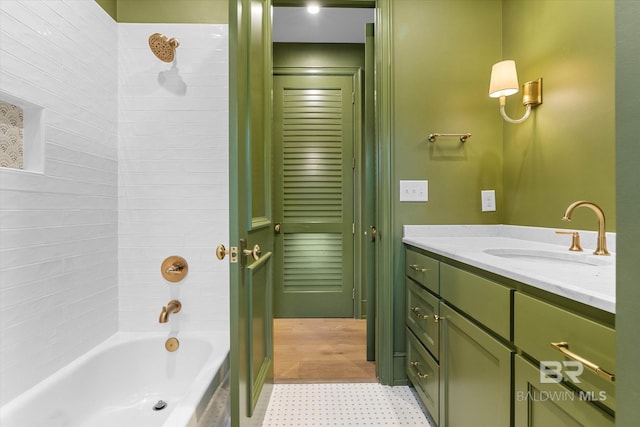full bath featuring tile patterned floors, vanity, and tub / shower combination