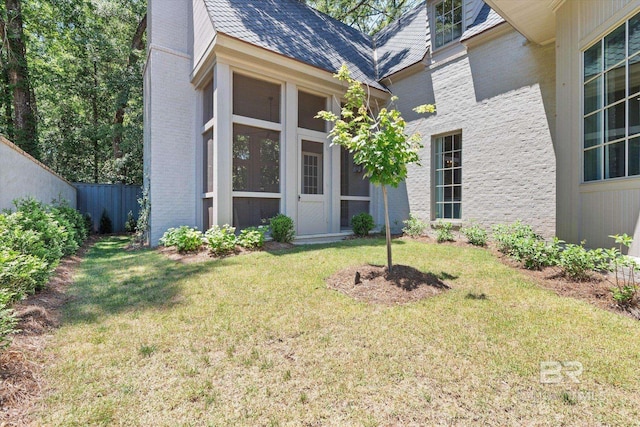 property entrance with brick siding and a chimney