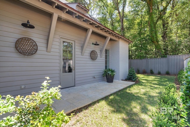 entrance to property featuring a patio area