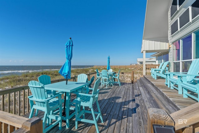 wooden deck with a water view