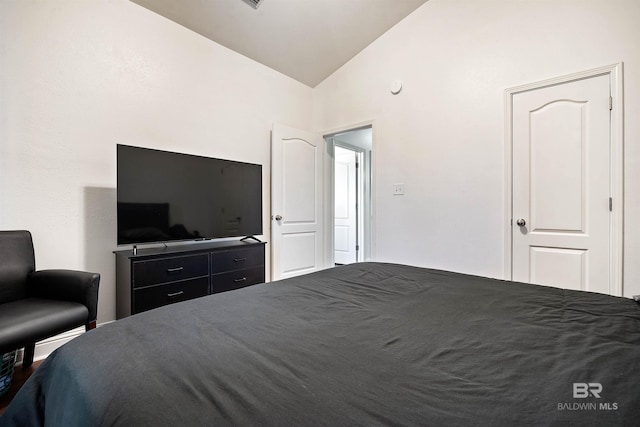 bedroom featuring vaulted ceiling