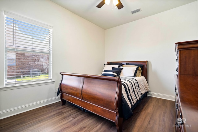 bedroom with baseboards, wood finished floors, and ceiling fan