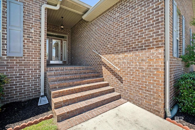 entrance to property with brick siding