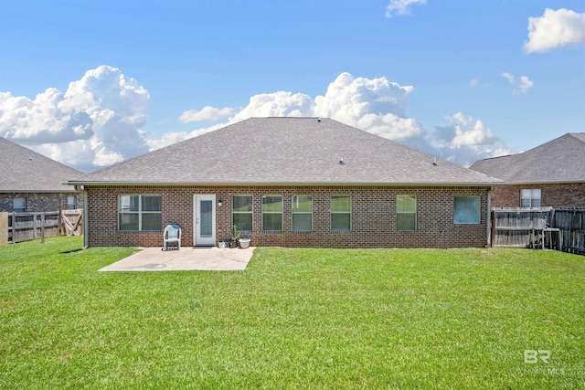 back of property with a patio, brick siding, and a shingled roof