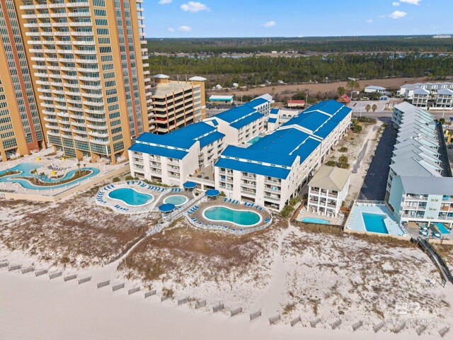 bird's eye view with a beach view and a water view