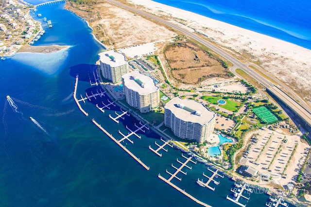 aerial view with a water view and a view of the beach