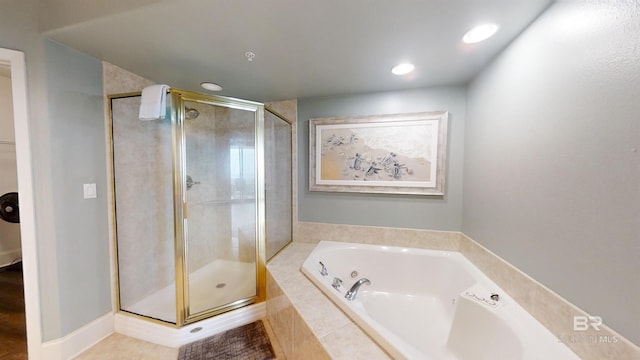 bathroom featuring a shower stall, recessed lighting, and a garden tub