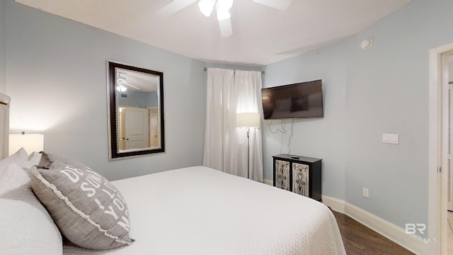 bedroom with baseboards, wood finished floors, and a ceiling fan