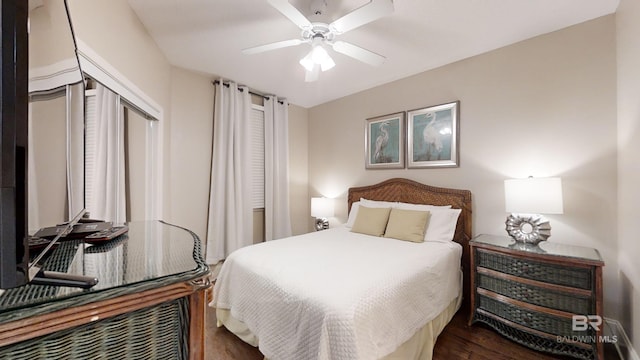 bedroom featuring wood finished floors and ceiling fan