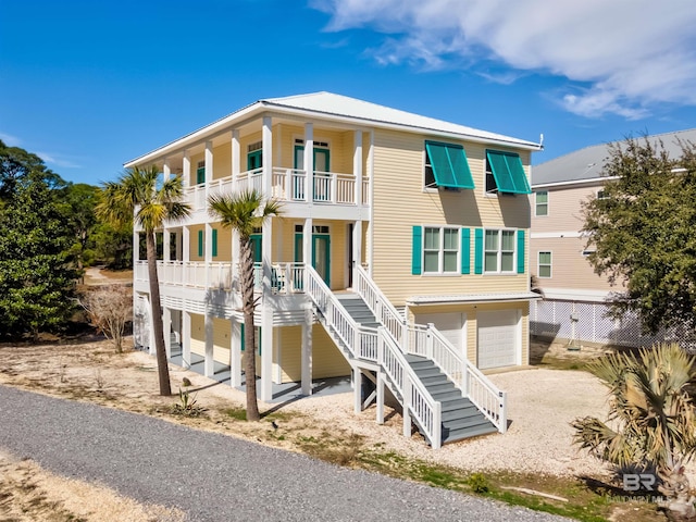 view of front of house with a balcony and a garage