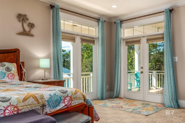 bedroom with french doors, ornamental molding, and access to outside