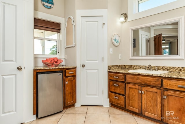 bathroom featuring tile floors and vanity