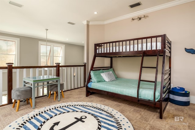 carpeted bedroom featuring crown molding