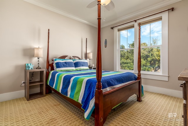 carpeted bedroom with ceiling fan and crown molding