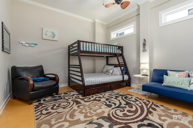 bedroom with crown molding, ceiling fan, and multiple windows