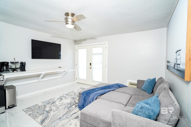 living room with ceiling fan and french doors