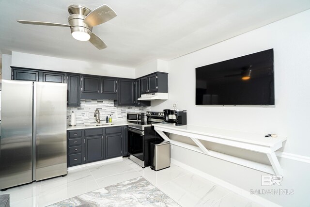 kitchen with ceiling fan, appliances with stainless steel finishes, sink, and decorative backsplash