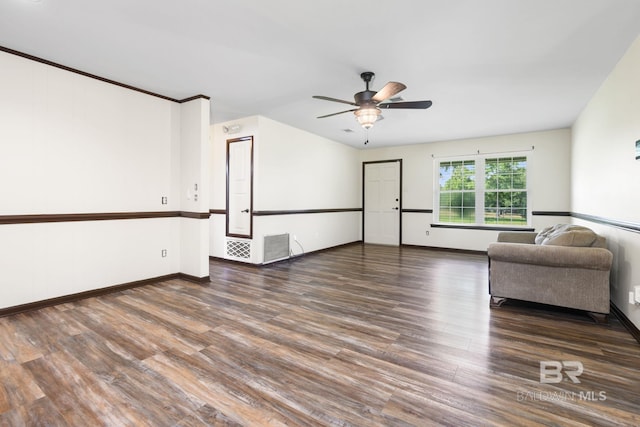 unfurnished living room featuring dark hardwood / wood-style floors and ceiling fan