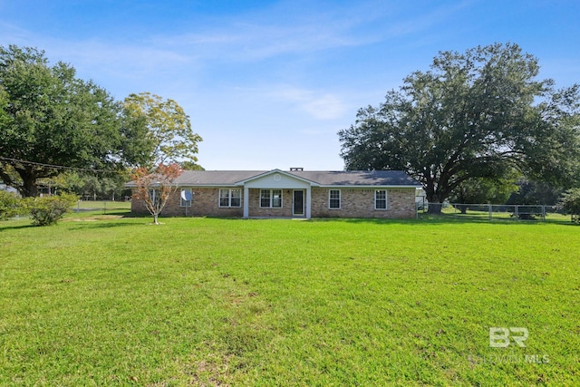 ranch-style house with a front lawn