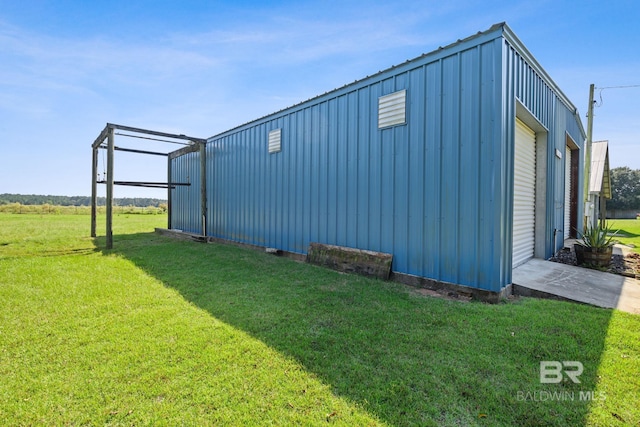 view of property exterior with a yard and a garage