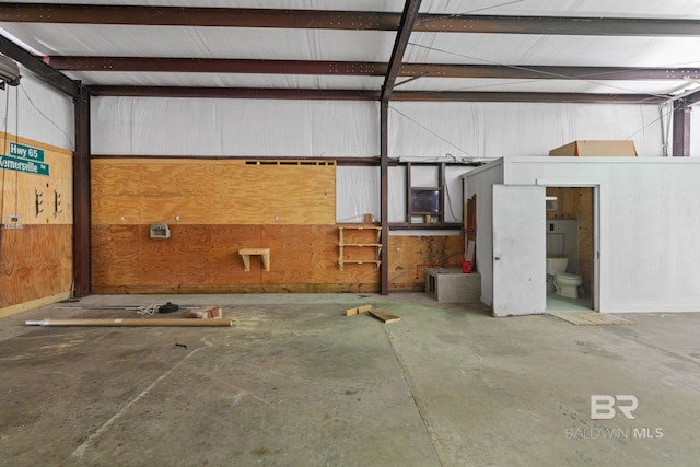 garage featuring wooden walls