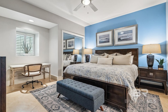 bedroom with tile patterned flooring, a ceiling fan, and baseboards