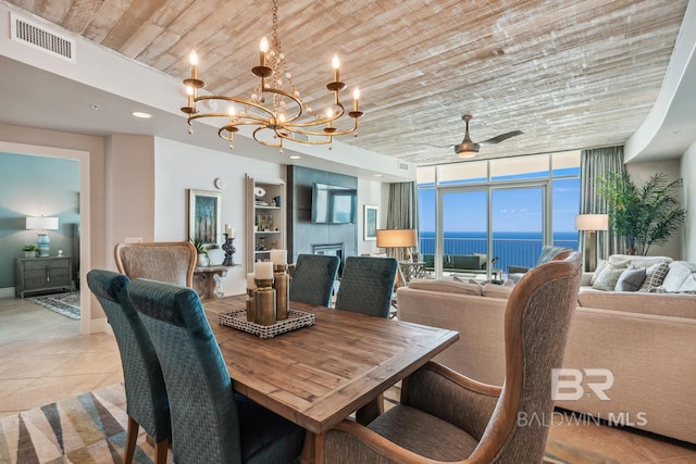 dining area with a wall of windows, light tile patterned floors, visible vents, wood ceiling, and ceiling fan with notable chandelier