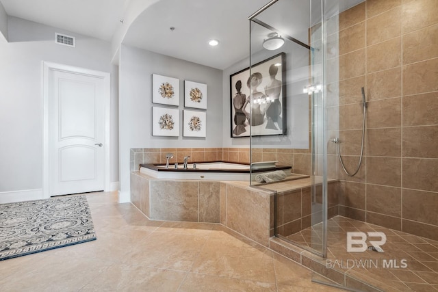 full bathroom with visible vents, a garden tub, a shower stall, and tile patterned flooring