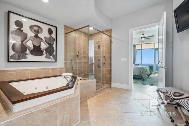 ensuite bathroom with tile patterned floors, a stall shower, a jetted tub, ensuite bath, and ceiling fan