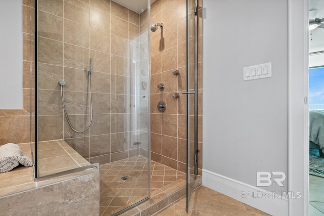 ensuite bathroom featuring ensuite bath, tile patterned floors, and tiled shower