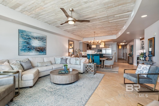 living area with ceiling fan with notable chandelier, recessed lighting, light tile patterned floors, a raised ceiling, and wood ceiling