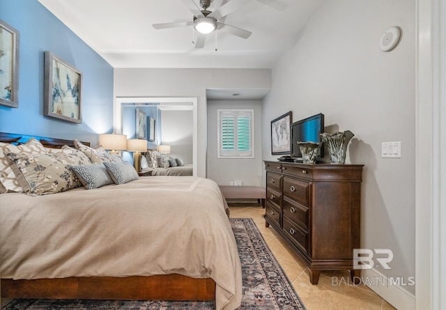 bedroom featuring light tile patterned floors and a ceiling fan