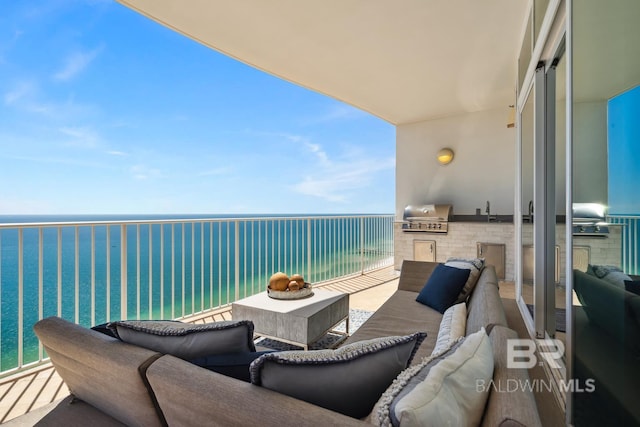 balcony featuring outdoor lounge area, area for grilling, and a water view