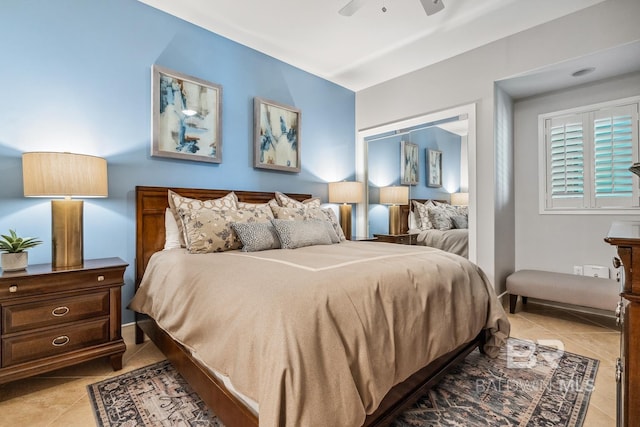 bedroom featuring tile patterned floors and ceiling fan