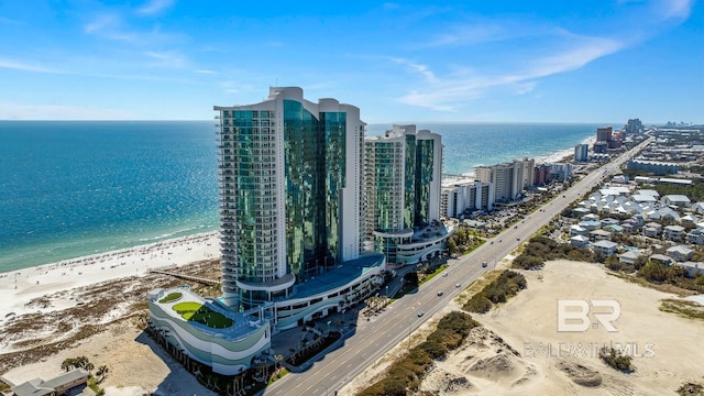 birds eye view of property with a water view, a view of city, and a view of the beach