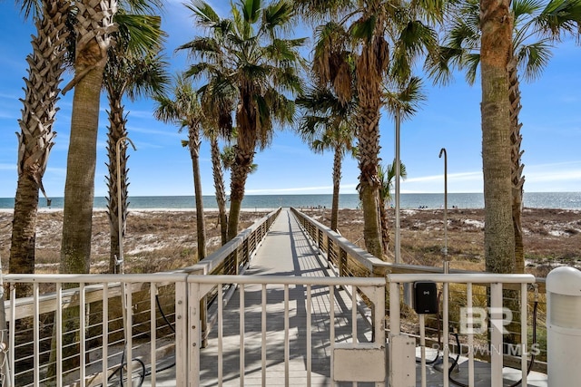 exterior space featuring a view of the beach and a water view