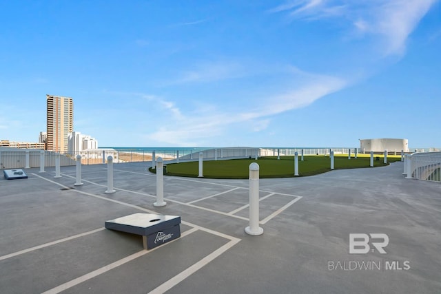 view of car parking featuring fence