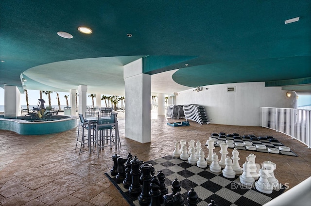 view of patio / terrace featuring outdoor dining space, a swimming pool, and visible vents