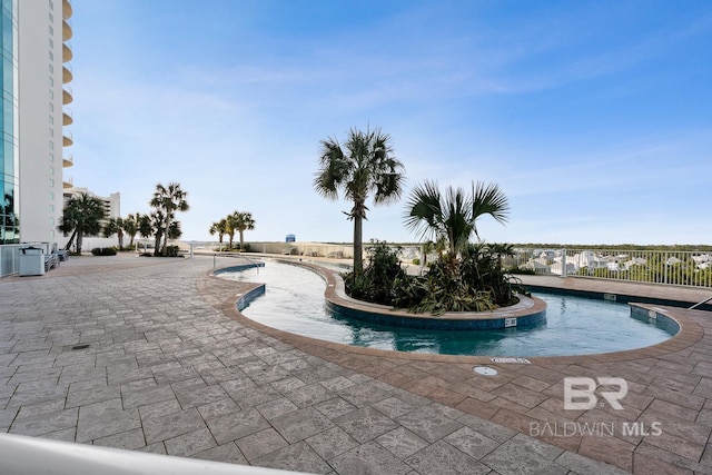 view of pool with fence