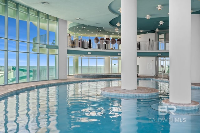 community pool with decorative columns