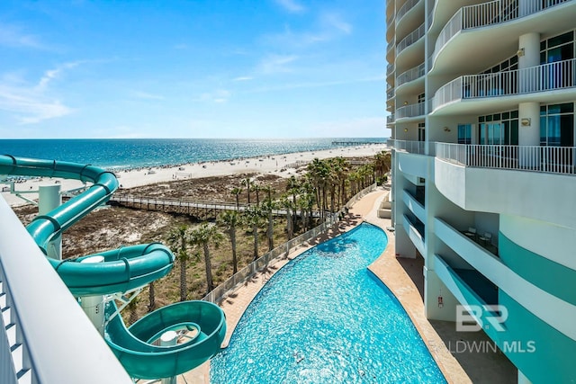 exterior space with a water view and a view of the beach