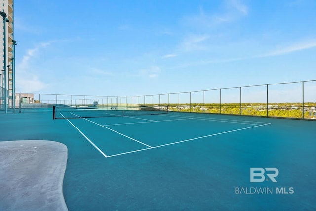 view of sport court with fence