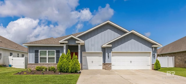 24774 Smarty Jones Cir, Daphne, AL 36526 - ranch-style house with brick siding, concrete driveway, board and batten siding, a garage, and roof with shingles