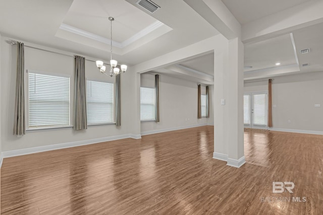 24774 Smarty Jones Cir, Daphne, AL 36526 - empty room featuring a raised ceiling, wood finished floors, a chandelier, ornamental molding, and recessed lighting