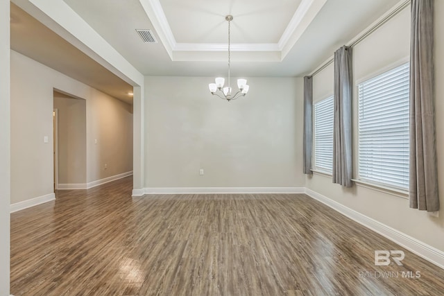 24774 Smarty Jones Cir, Daphne, AL 36526 - empty room with a tray ceiling, wood finished floors, a chandelier, baseboards, and ornamental molding