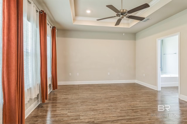 24774 Smarty Jones Cir, Daphne, AL 36526 - spare room with a raised ceiling, crown molding, dark wood-style flooring, a ceiling fan, and baseboards